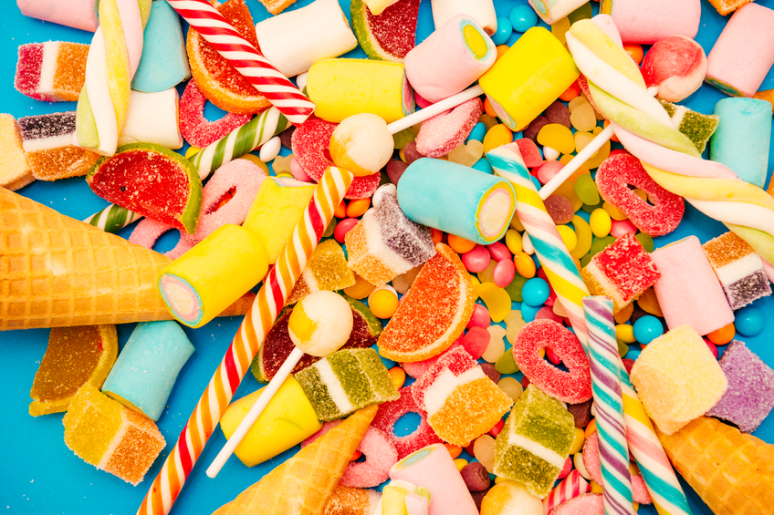 Christmas candy - sweet food and candy concept on blue